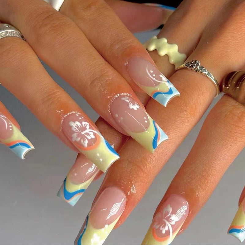 Artistic nail art with floral accents and creative color layers Bowlift