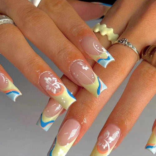 Artistic nail art with floral accents and creative color layers Bowlift