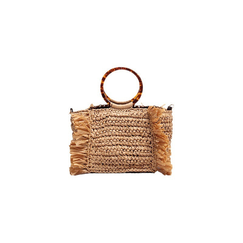 Handmade raffia shoulder bag with fringed accents Bowlift
