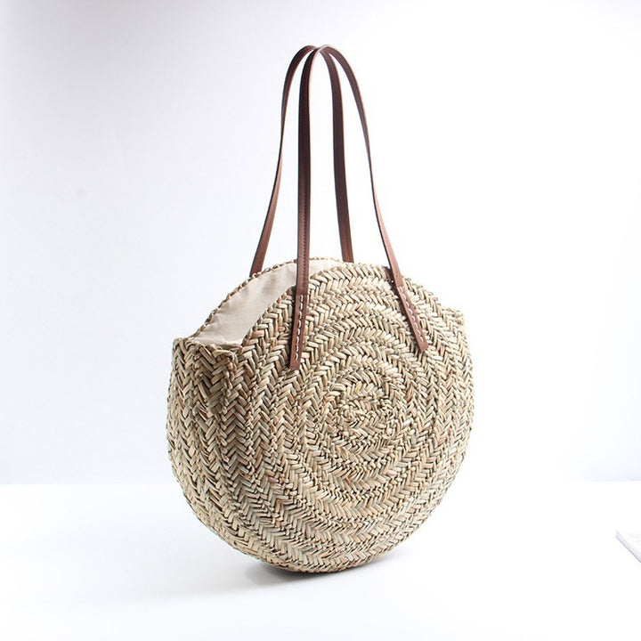 Braided straw beach bag with elegant leather handles Bowlift
