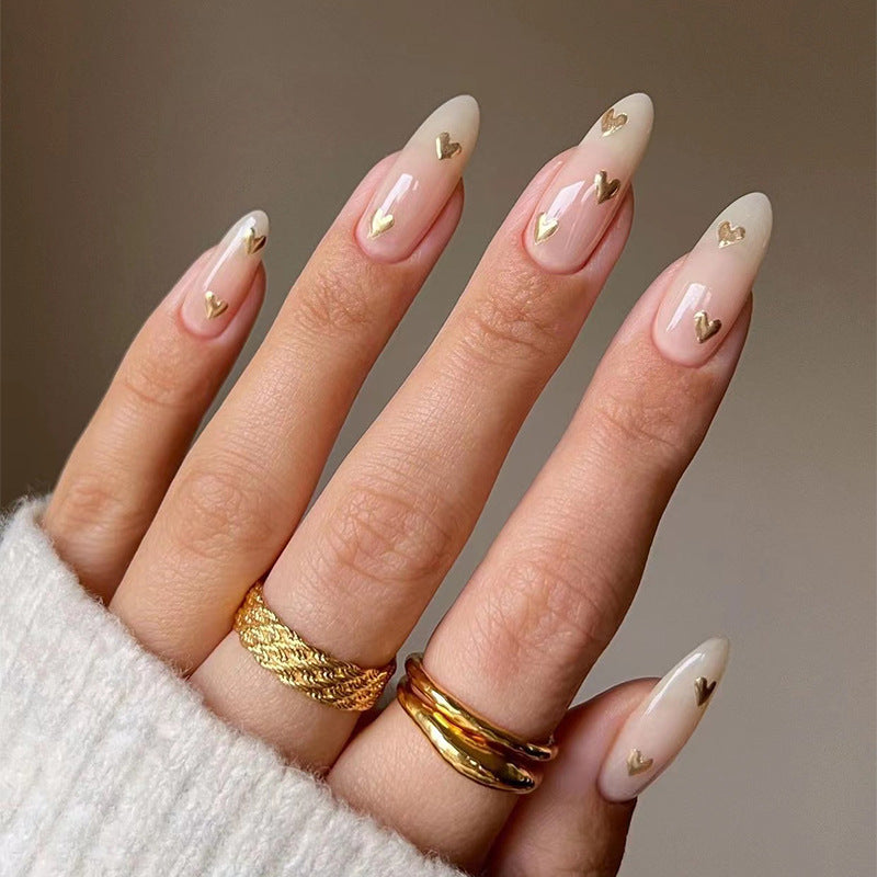 Artful Nail Art with Golden Heart Accents Bowlift