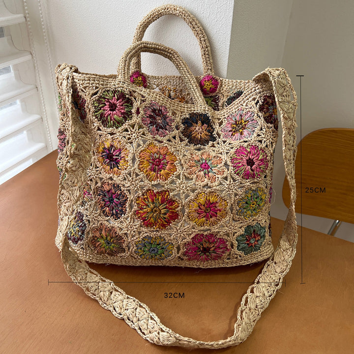 Braided shoulder bag with floral motif Bowlift