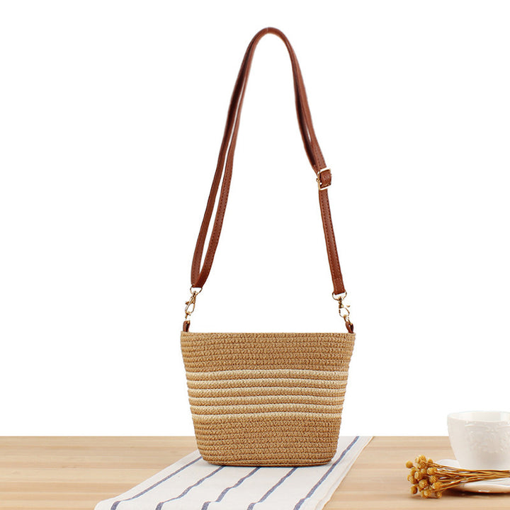 Shoulder bag made of woven natural material with contrasting stripes Bowlift