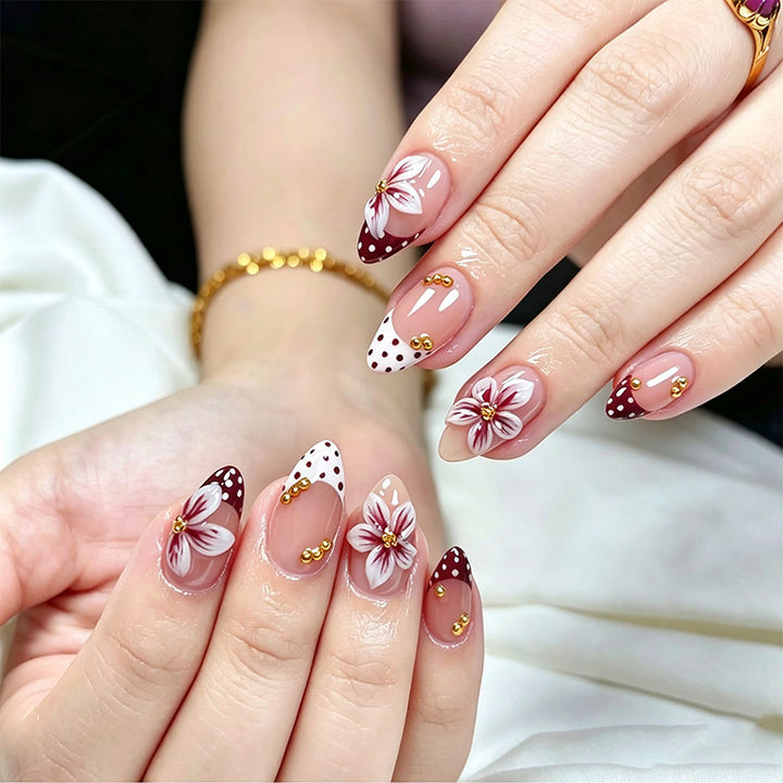 Artificial nail set with floral design and golden accents Bowlift
