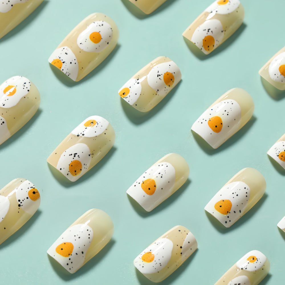 Artificial nails in creative fried egg design Bowlift