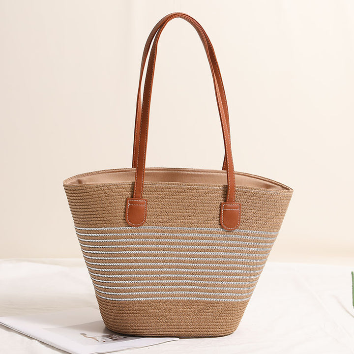 Elegant bast handbag with leather accents Bowlift