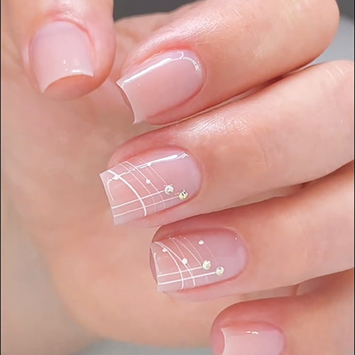 Artful nail extensions with elegant design and rhinestone embellishments Bowlift