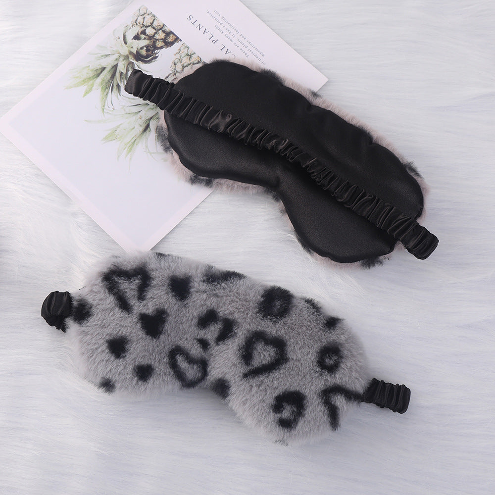 Women's cuddly faux fur sleep mask with heart-embossed surface and gathered comfort band Bowlift