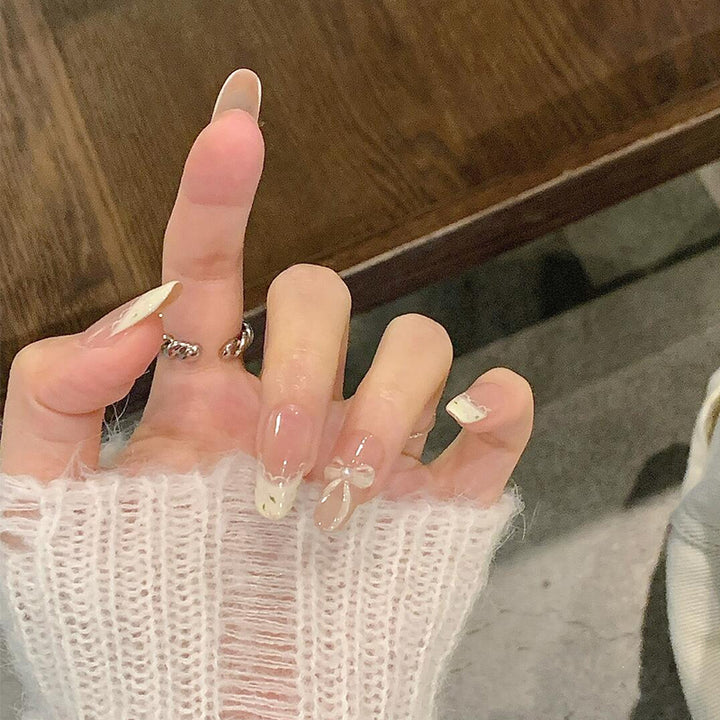 Artificial nails with elegant tip embellishment and romantic details Bowlift