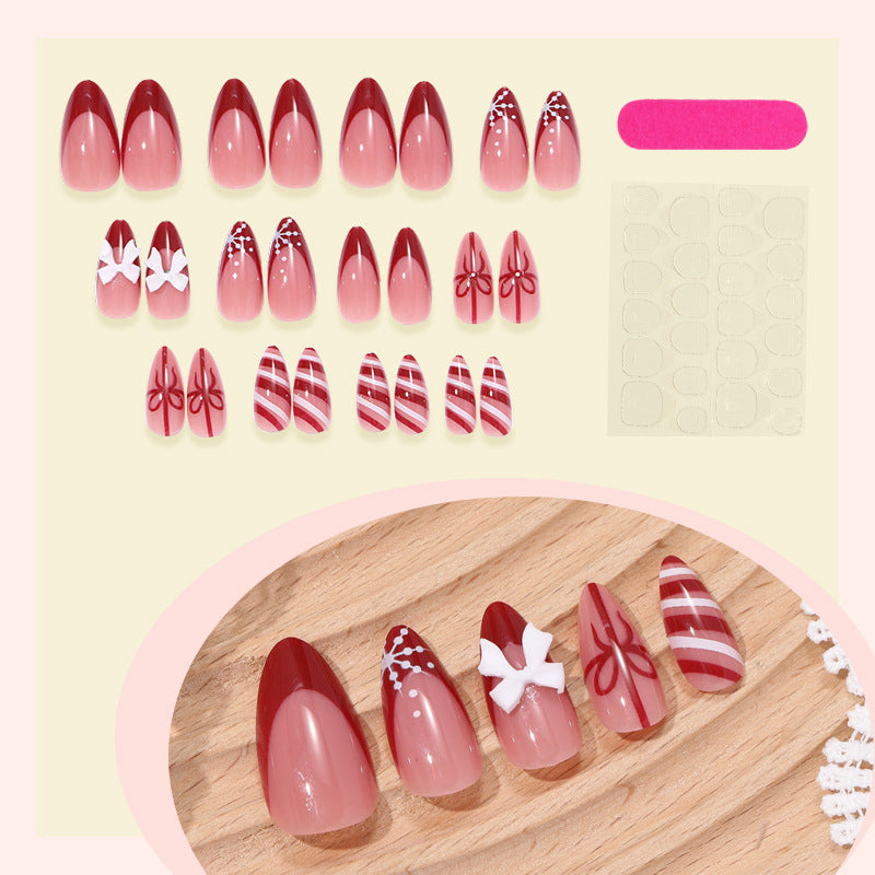 Artificial nail set with festive bow and stripe designs Bowlift
