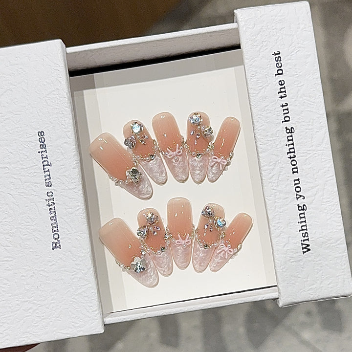 Artificial nails with romantic rhinestone details Bowlift