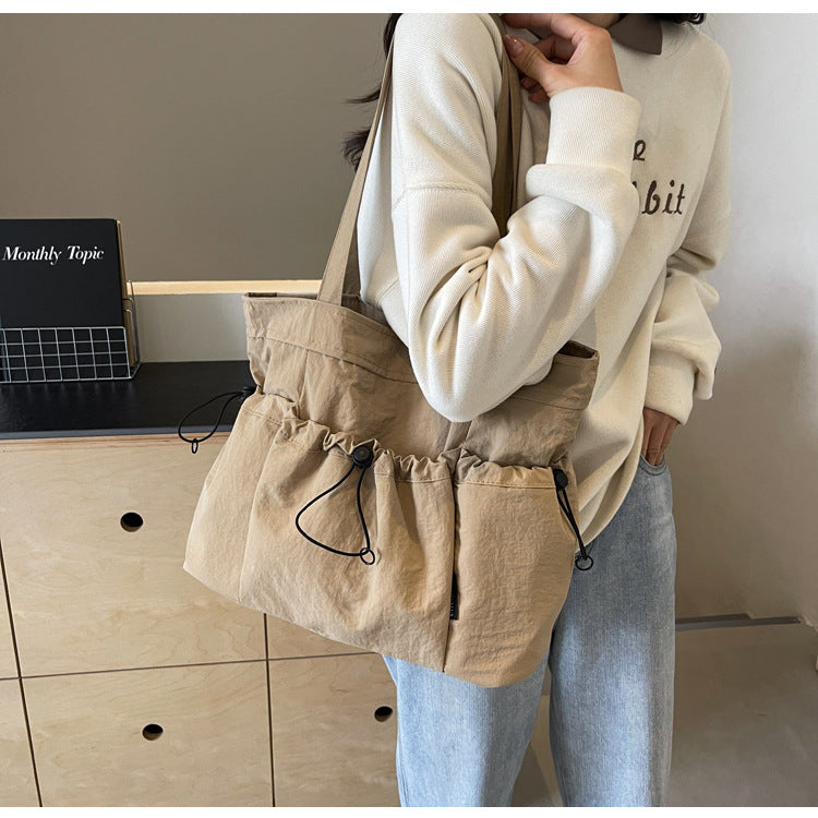 Practical everyday handbag with drawstring Bowlift