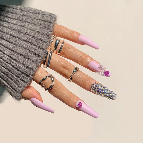 Artistic Stiletto Nails with Glitter and Flower Decorations Bowlift