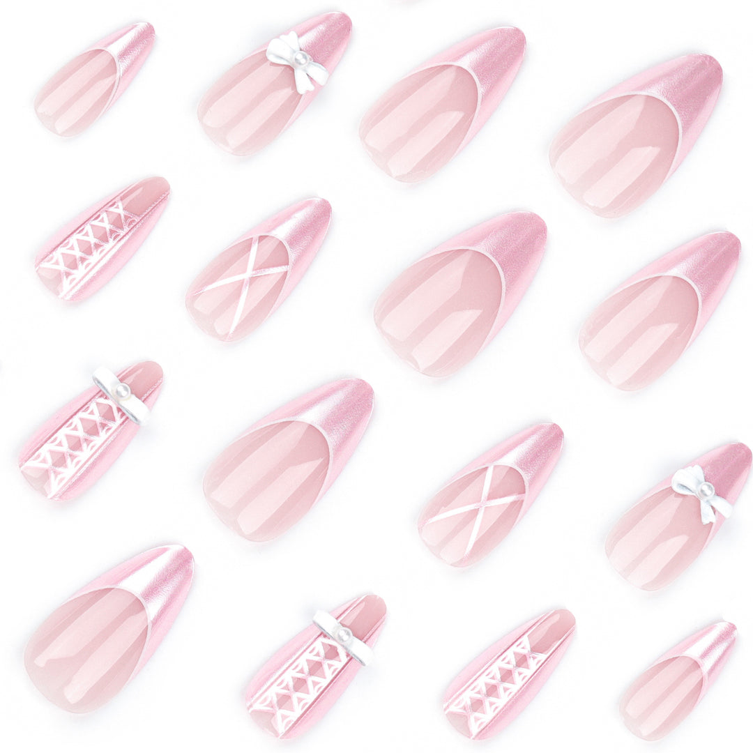 Artistic stiletto nails with elegant pearl and bow accents Bowlift