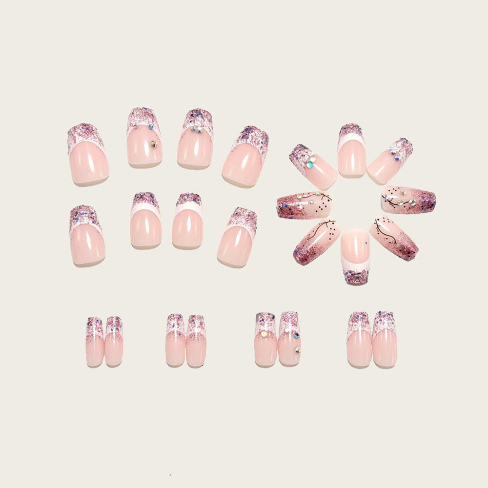 Glamorous artificial nails with glitter and rhinestone embellishments Bowlift