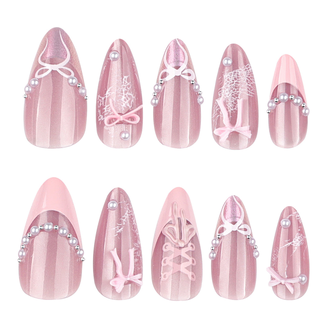 Artful nail extensions with delicate bow motifs Bowlift