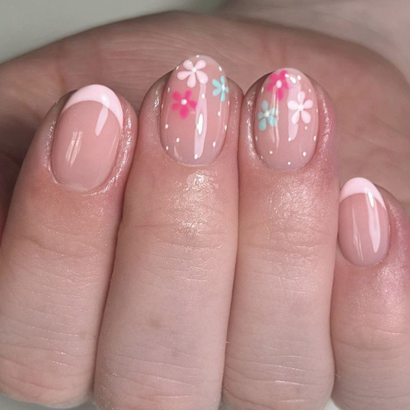 Artful nail extensions with colorful floral designs and glitter Bowlift