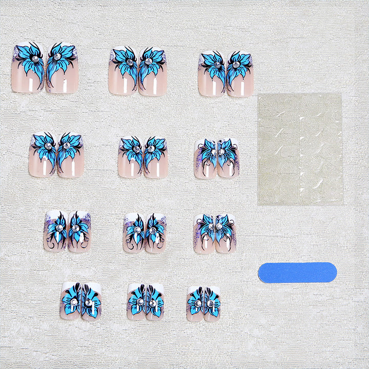 Artificial nail set with intricate floral designs and glitter elements Bowlift