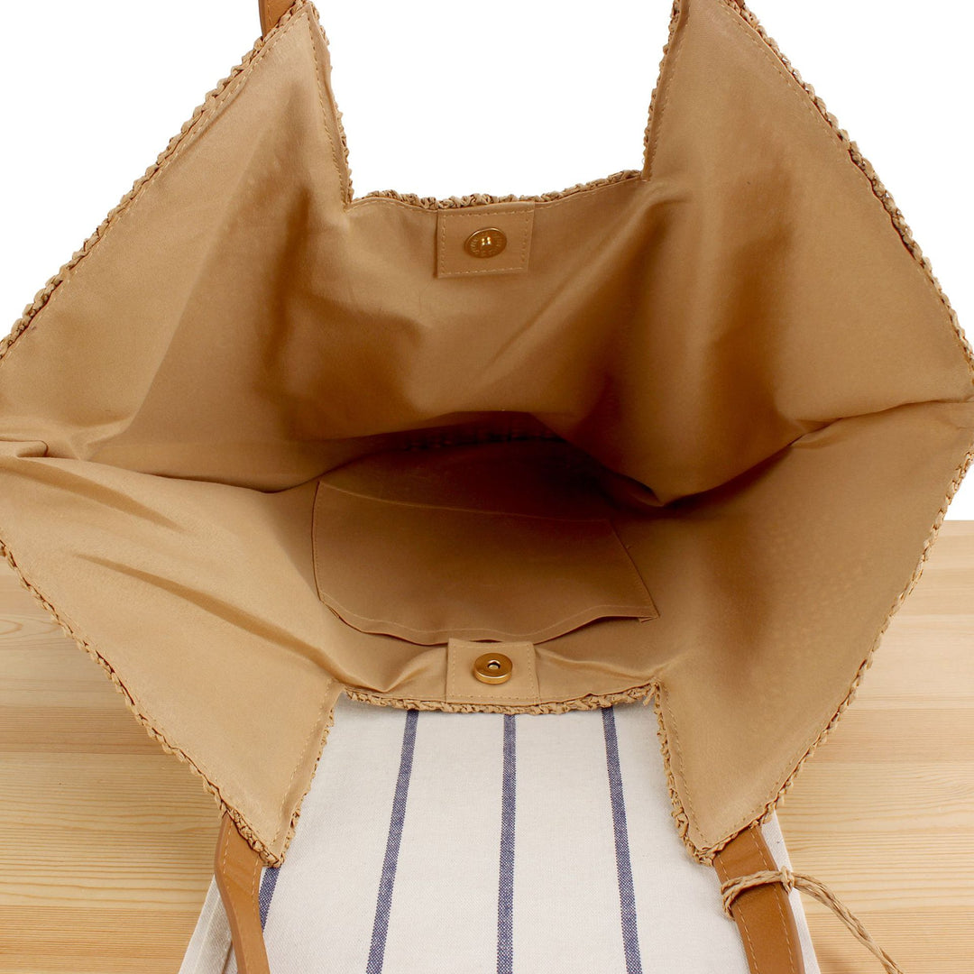 Beach bag made of natural weave with elegant leather accents Bowlift