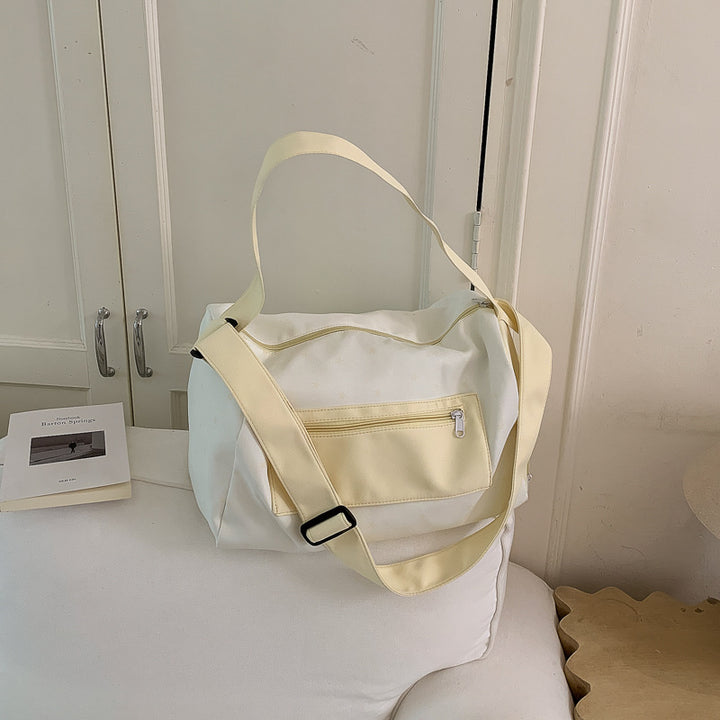 Sporty shoulder bag with practical slip pockets Bowlift