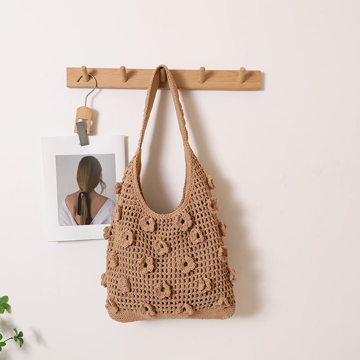 Hand-knotted shoulder bag with floral structural elements Bowlift