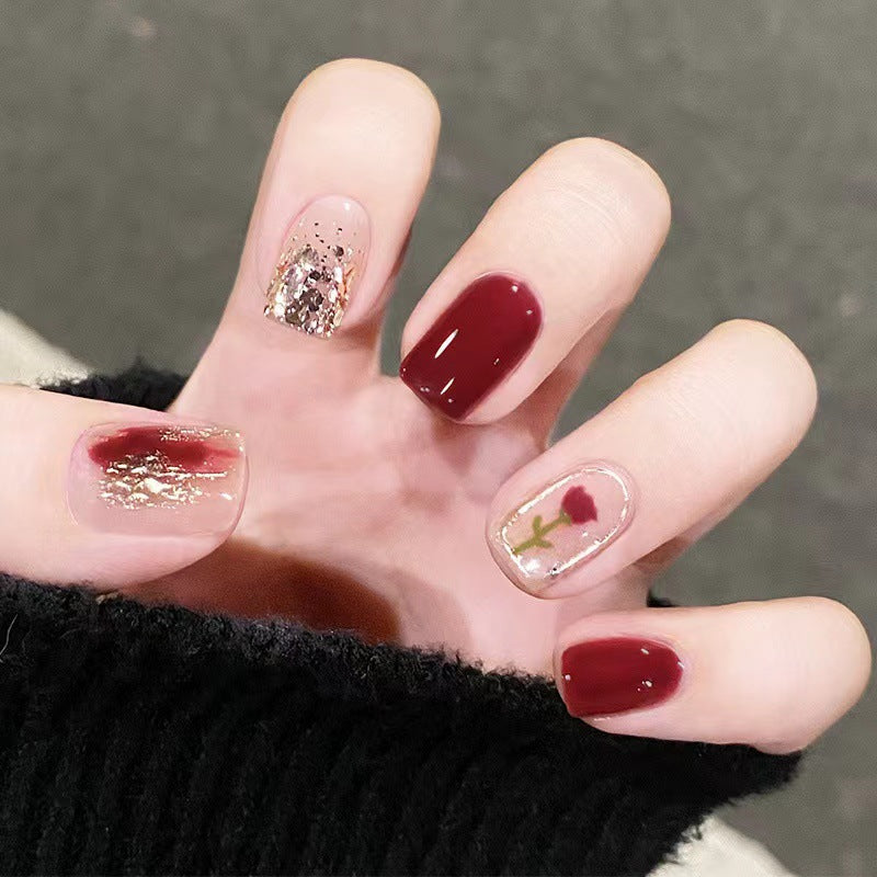 Elegant nail design with floral and sparkling accents Bowlift