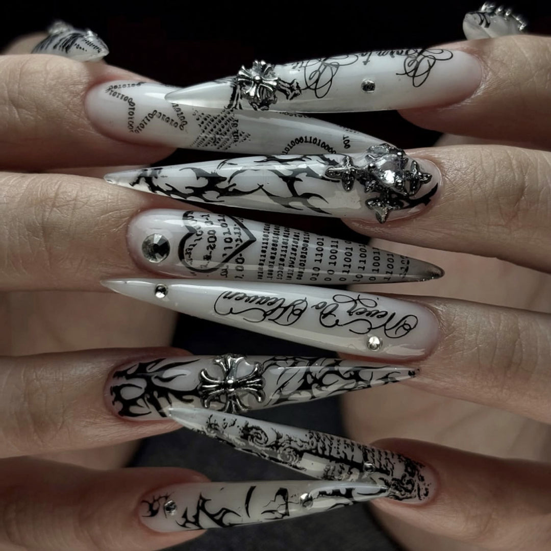 Artful stiletto nails with elegant floral design and glitter details Bowlift