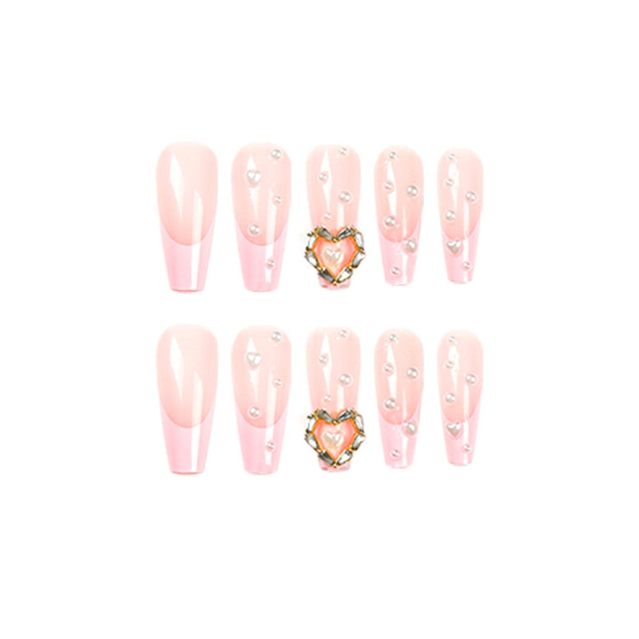 Artistic nail art with heart and pearl accents Bowlift