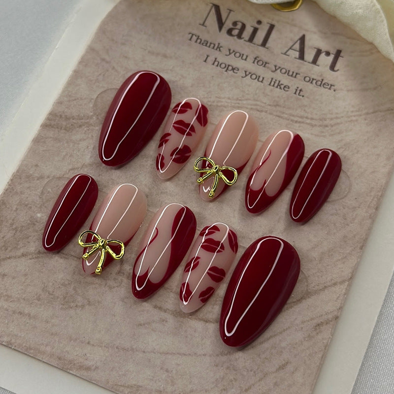 Artificial nail set with elegant bow and lip designs Bowlift