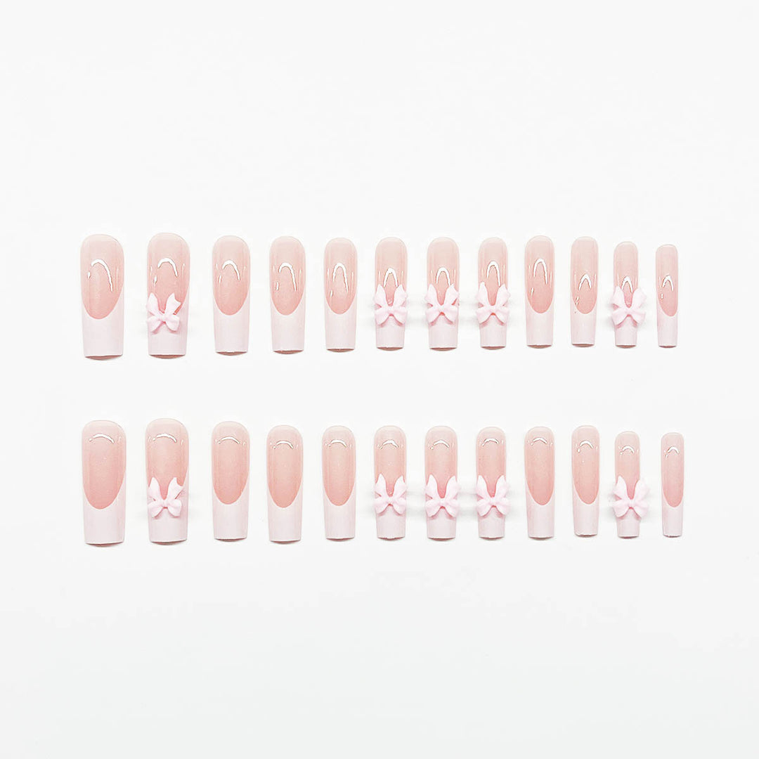 Artificial nails with playful bow design Bowlift