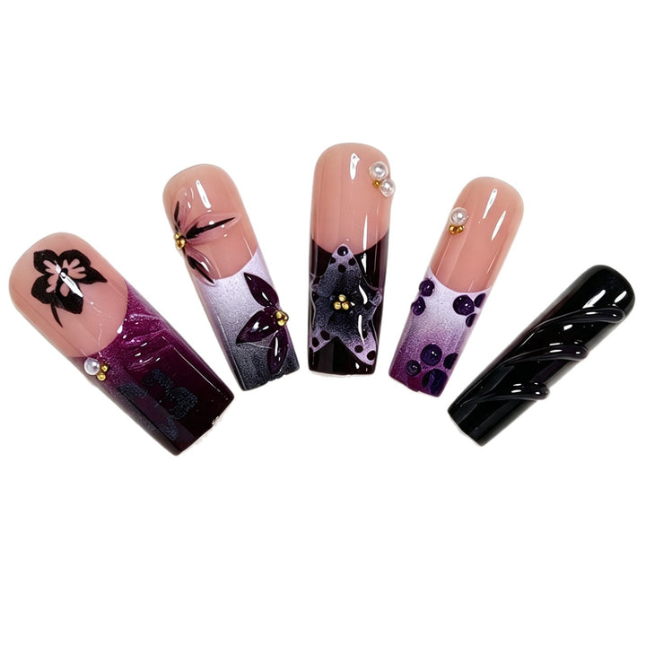 Artistic Long Nail Design with Floral Accents Bowlift