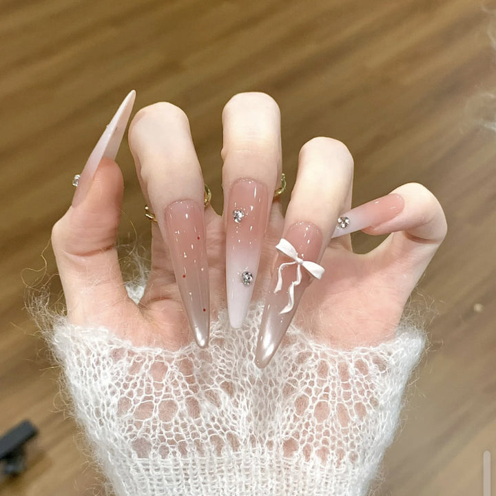 Artificial nails with elegant ombre effect and delicate rhinestone embellishments Bowlift