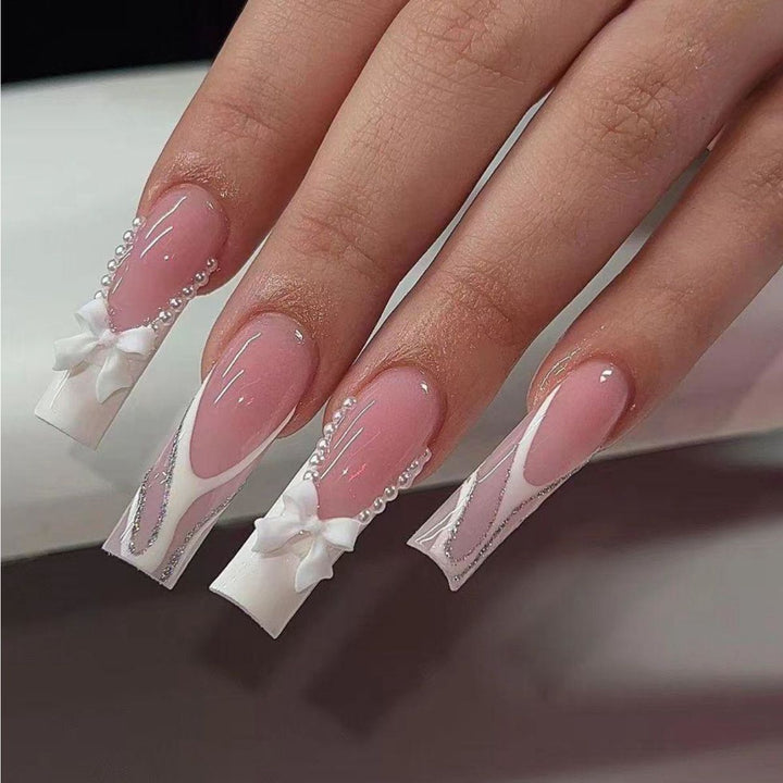 Artificial nail set with elegant bow and pearl decorations Bowlift