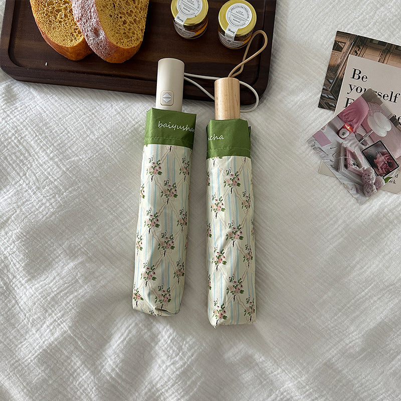 Ladies elegant folding umbrella with floral design Bowlift