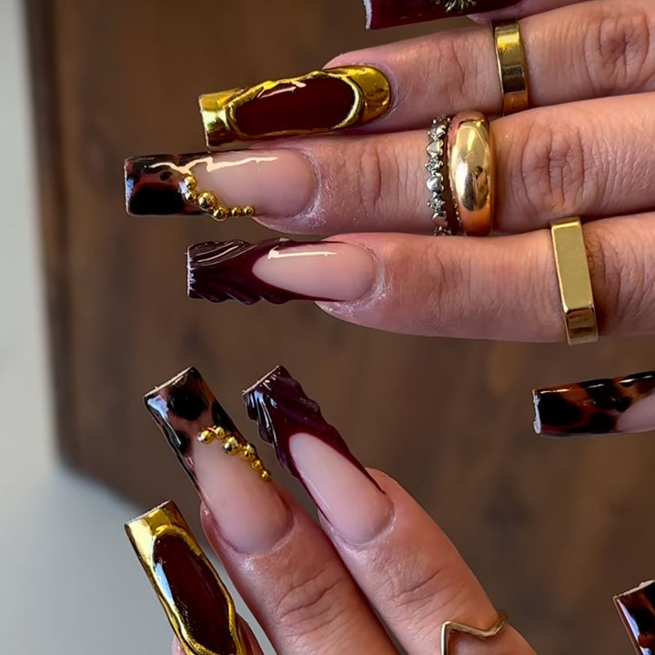 Artistic Long Press-On Nails with Elegant Accents Bowlift