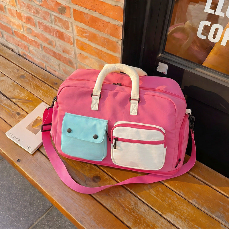 Sporty travel bag with multiple pockets and adjustable shoulder strap Bowlift