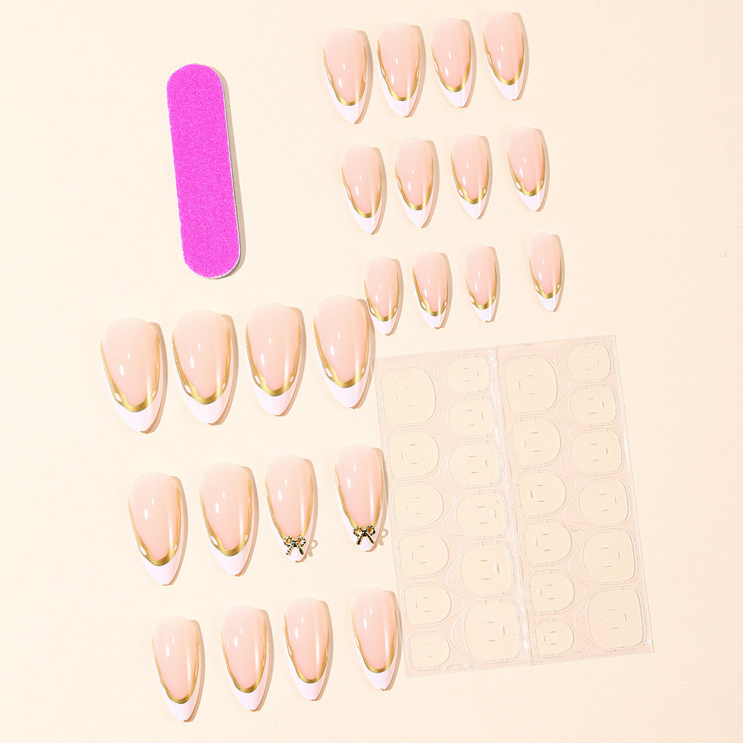 Elegant French Tip Nail Extensions with Gold Accents Bowlift