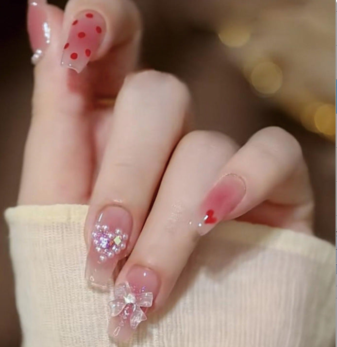 Artistic Nail Art with Glitter and Flower Applications Bowlift