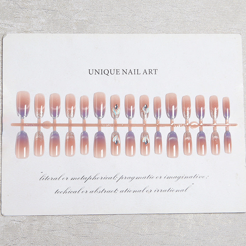 Acrylic nail set with elegant glitter effect and beautified embellishments Bowlift