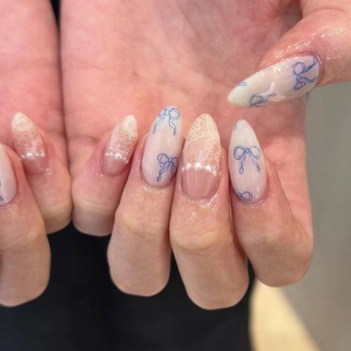 Artistic stiletto nails with delicate bow decorations Bowlift