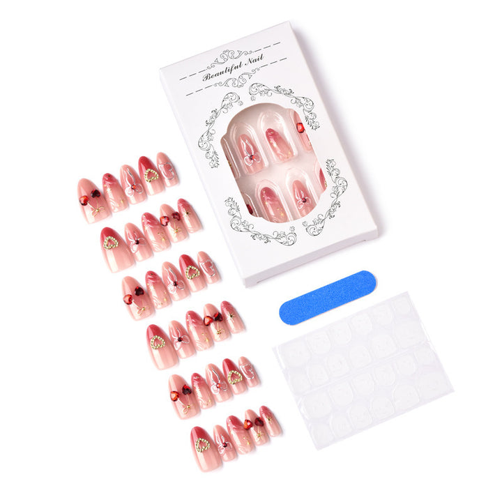 Decorative artificial nails with romantic heart and bow motifs Bowlift