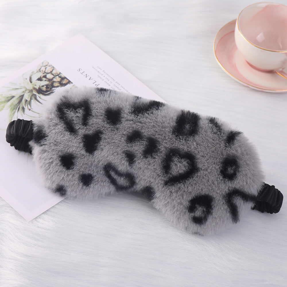 Women's cuddly faux fur sleep mask with heart-embossed surface and gathered comfort band Bowlift