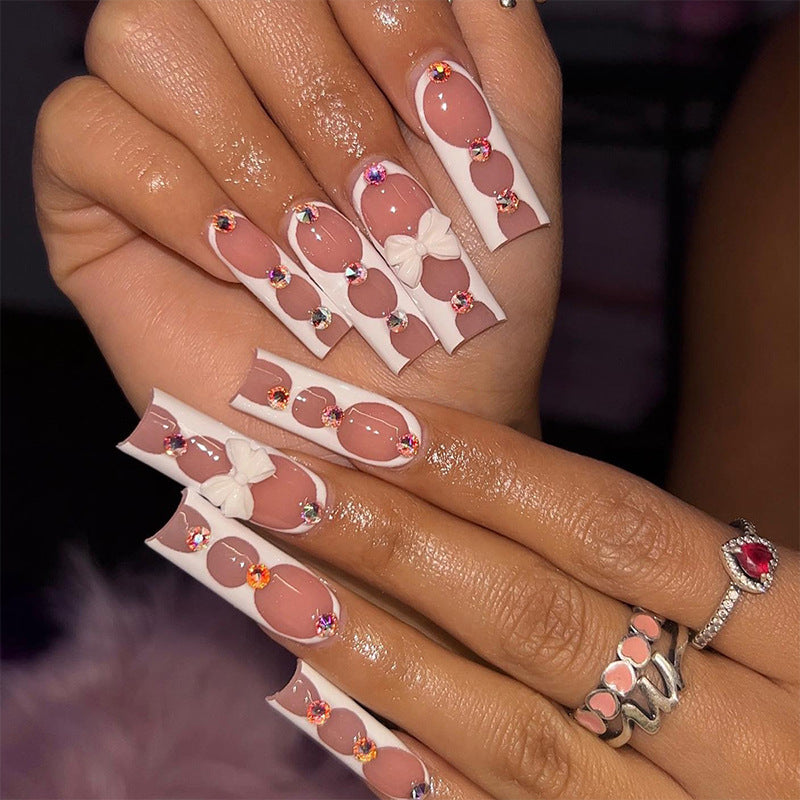Elegant and artistic nail art with rhinestone details Bowlift