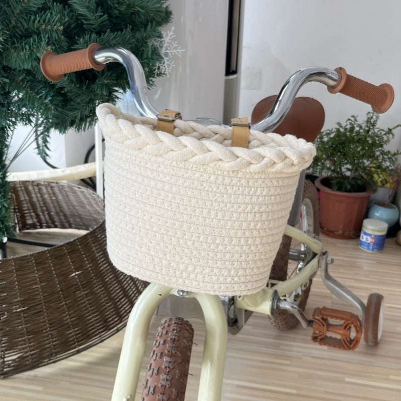 braided rope bike basket with pom pom embellishments and leather handlebar straps Bowlift