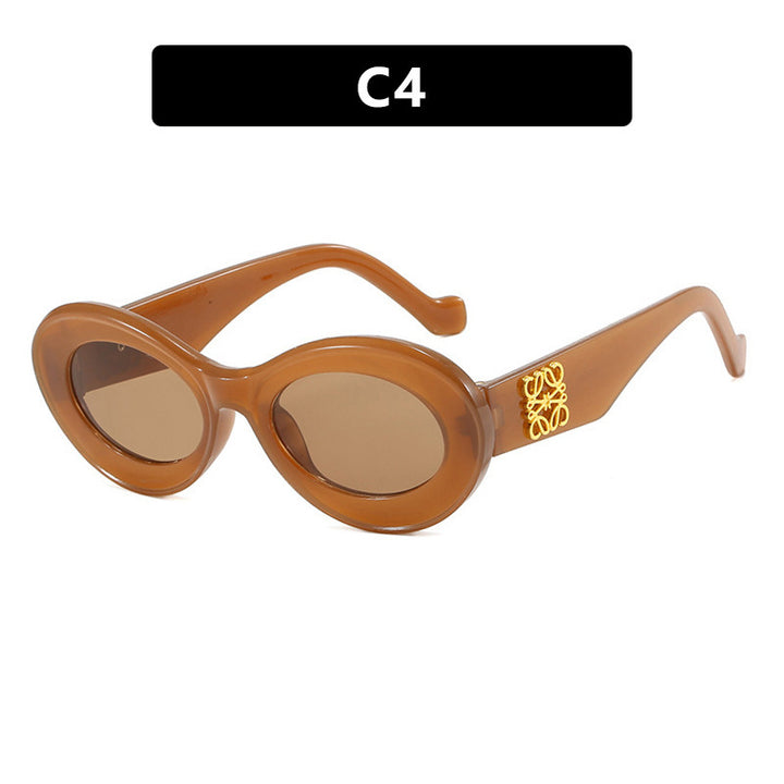 Women's fashionable sunglasses with oval frame and golden accents Bowlift