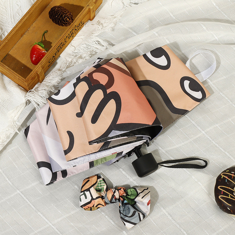 Women's folding umbrella with colorful animal design and durable frame Bowlift