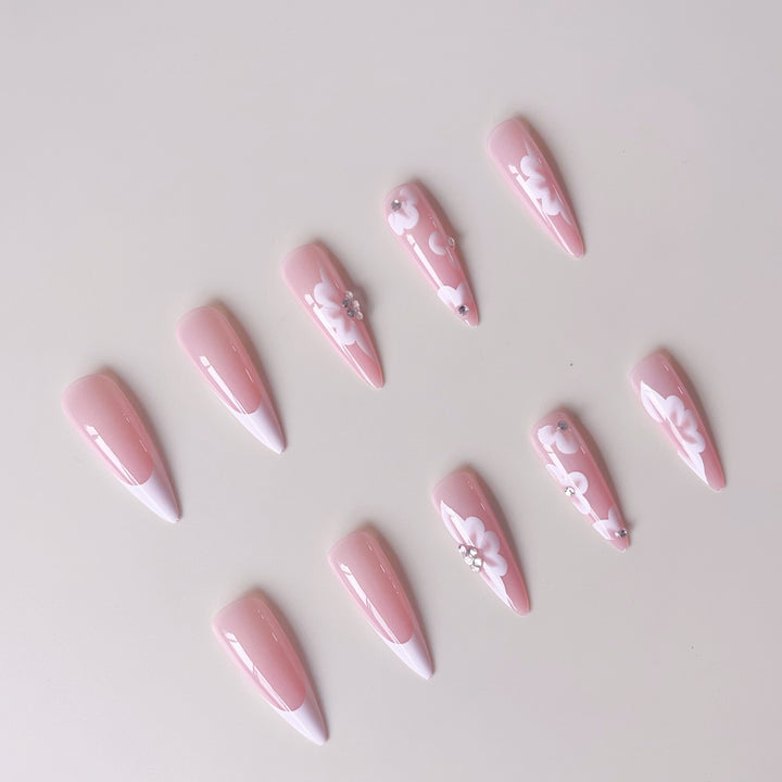Elegant artificial nail set with floral design and glitter accents Bowlift