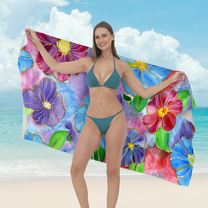 Beach towel with vibrant tropical plant motif Bowlift