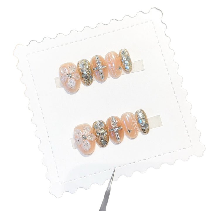 Glamorous artificial nails with floral and glittering accents Bowlift