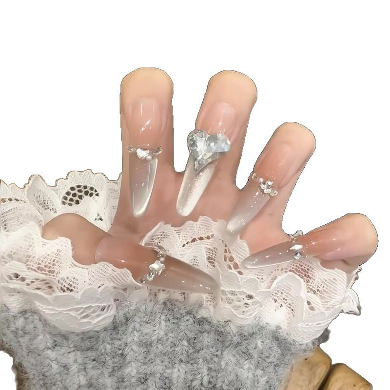 Acrylic nail set with elegant tips and glamorous rhinestone accents Bowlift